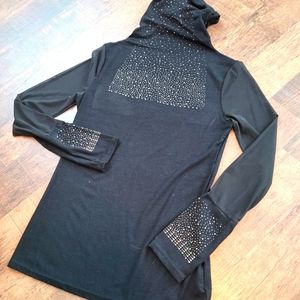 Black turtleneck with sheer sleeves